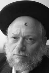 Rabbi Nuchum Rosenberg claims that threats against him culminated in his being shot in the forehead last month by unknown assailants. Michael Datikash
